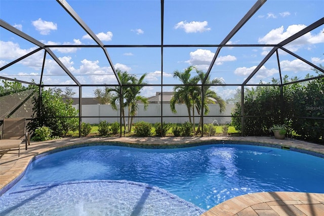 view of swimming pool with a lanai and a patio