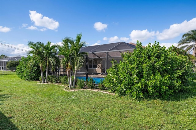 view of yard featuring a lanai