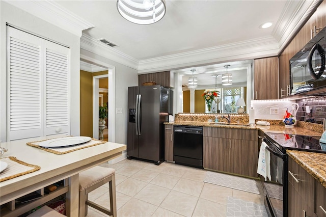 kitchen featuring sink, decorative backsplash, light tile patterned floors, black appliances, and ornamental molding