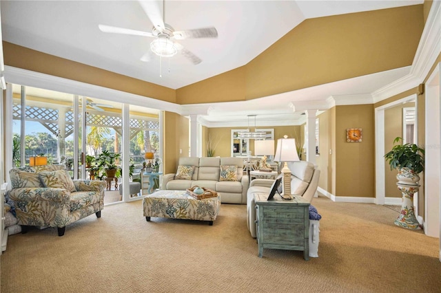 living room with light carpet, decorative columns, ornamental molding, vaulted ceiling, and ceiling fan