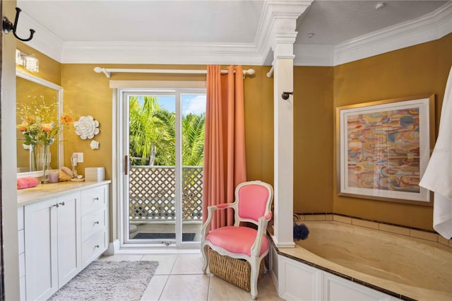 bathroom featuring vanity, crown molding, tile patterned flooring, and a bathtub