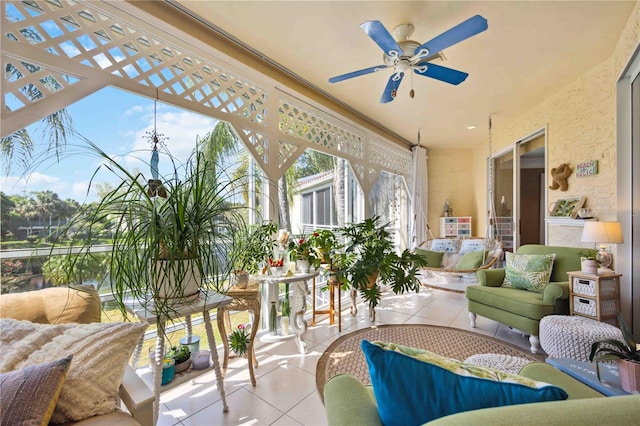 sunroom / solarium featuring ceiling fan