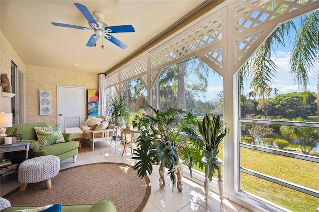 sunroom featuring ceiling fan