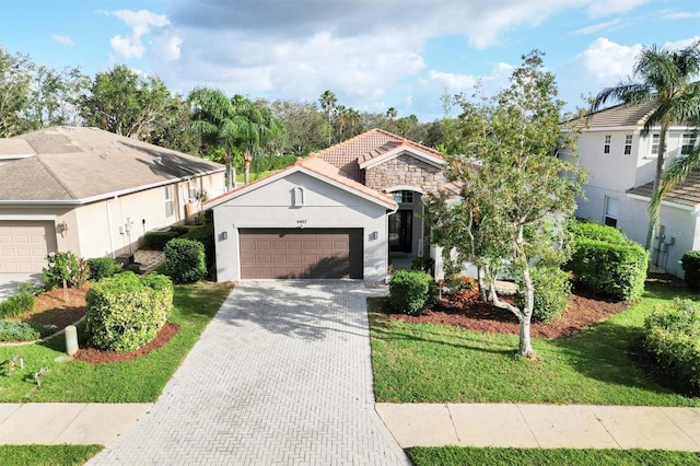 view of front of home featuring a front lawn and a garage