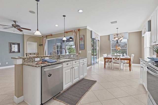 kitchen featuring sink, light stone counters, crown molding, white cabinets, and appliances with stainless steel finishes