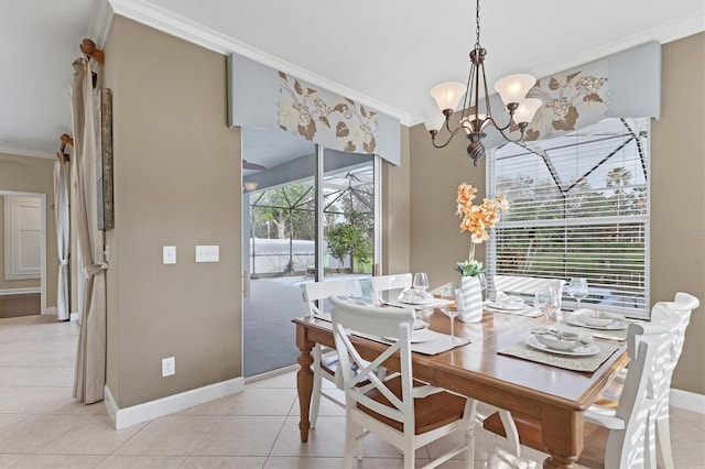 tiled dining area featuring crown molding and a notable chandelier