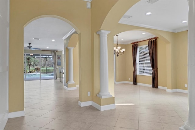 hallway featuring crown molding, light tile patterned flooring, and a chandelier