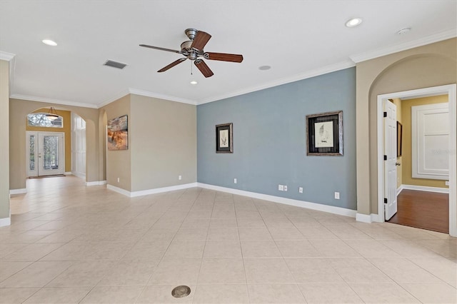 unfurnished room featuring ceiling fan, light tile patterned floors, and crown molding