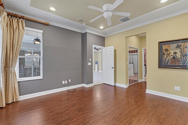 empty room featuring ceiling fan, dark hardwood / wood-style flooring, and ornamental molding