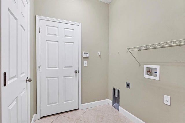 washroom with hookup for a washing machine, light tile patterned floors, and electric dryer hookup