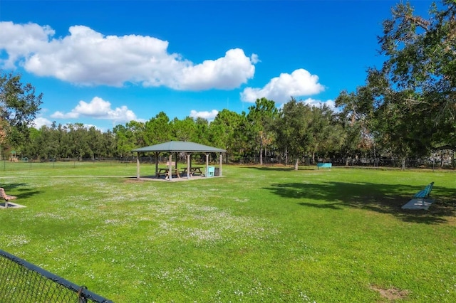 view of property's community with a gazebo and a lawn