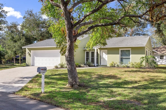 single story home featuring a garage and a front yard