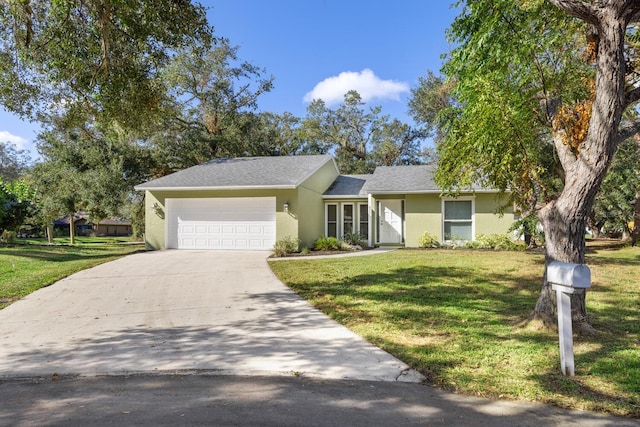 ranch-style house featuring a front yard and a garage