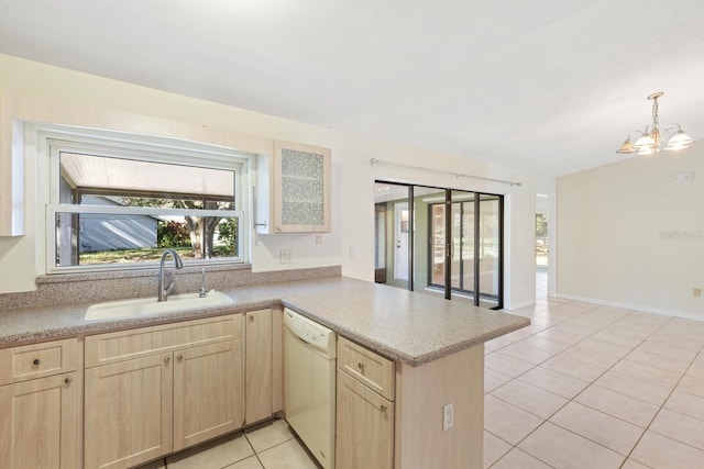 kitchen featuring dishwasher, light brown cabinets, an inviting chandelier, sink, and kitchen peninsula