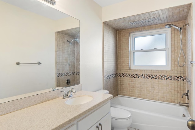 full bathroom with vanity, toilet, and tiled shower / bath