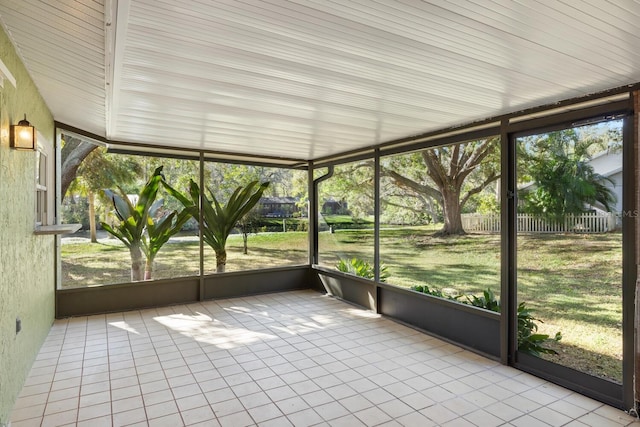 unfurnished sunroom featuring a wealth of natural light