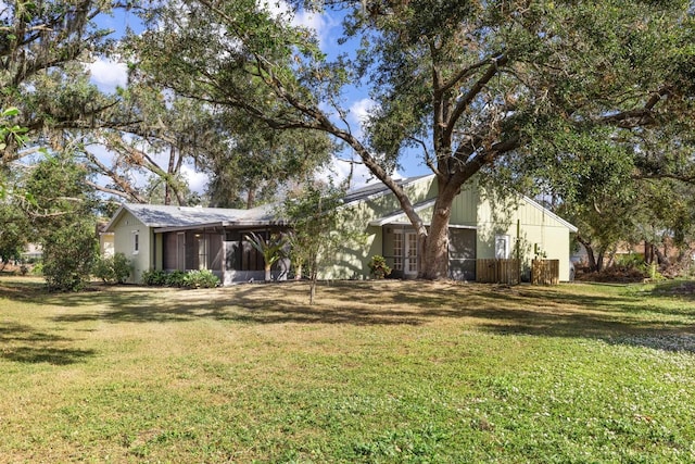 view of yard featuring a sunroom