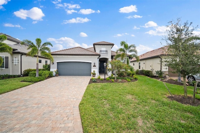 mediterranean / spanish-style home featuring a garage and a front lawn