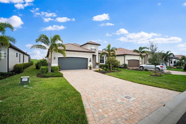 view of front facade featuring a garage and a front lawn