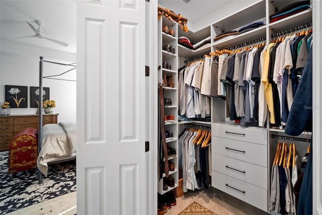 spacious closet featuring ceiling fan