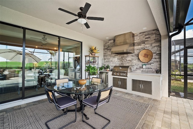 sunroom featuring ceiling fan