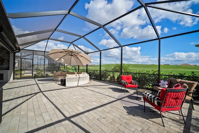 view of patio / terrace with outdoor lounge area and glass enclosure