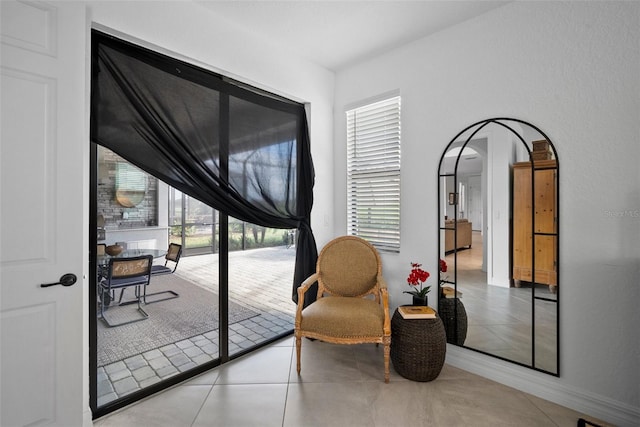 sitting room with light tile patterned floors