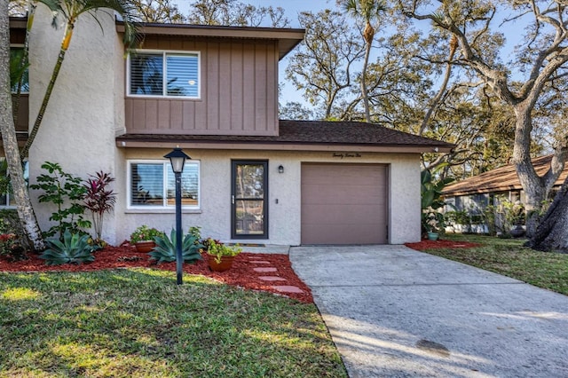 front of property with a front lawn and a garage