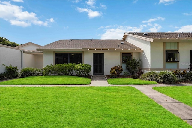 view of front of home with a front yard