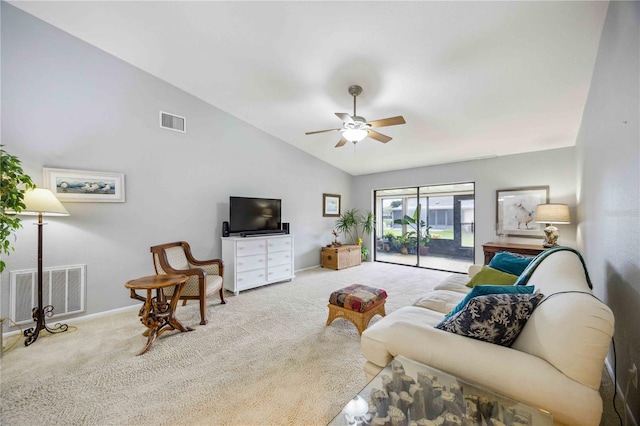 living room with ceiling fan, light colored carpet, and lofted ceiling