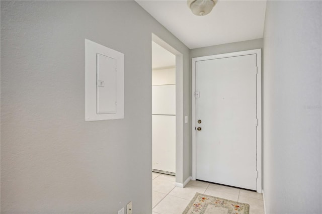 doorway featuring light tile patterned floors and electric panel