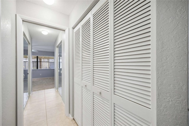 corridor with light tile patterned floors