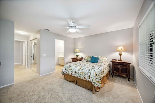 carpeted bedroom featuring ceiling fan and connected bathroom