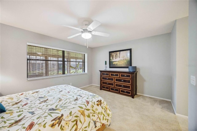 bedroom featuring light carpet and ceiling fan