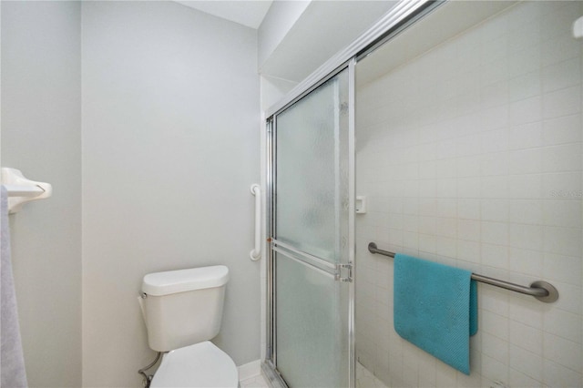 bathroom with toilet and walk in shower