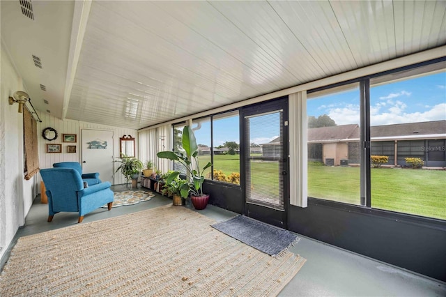 unfurnished sunroom featuring lofted ceiling