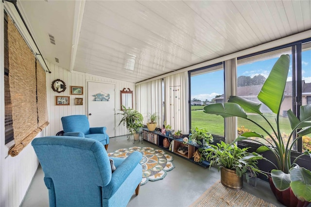 sunroom / solarium featuring lofted ceiling