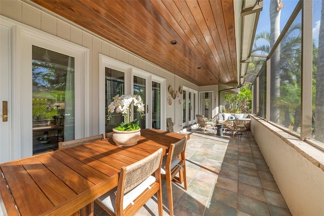 sunroom / solarium featuring wooden ceiling