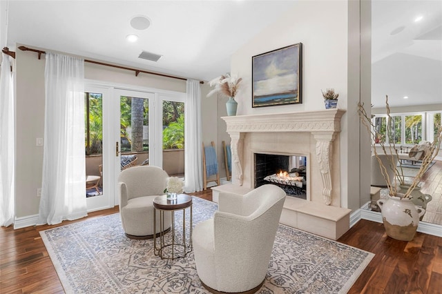 living room featuring dark hardwood / wood-style flooring and lofted ceiling