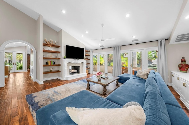 living room with hardwood / wood-style floors, french doors, high vaulted ceiling, and ceiling fan