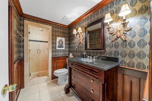 bathroom with vanity, tile patterned floors, crown molding, toilet, and an enclosed shower