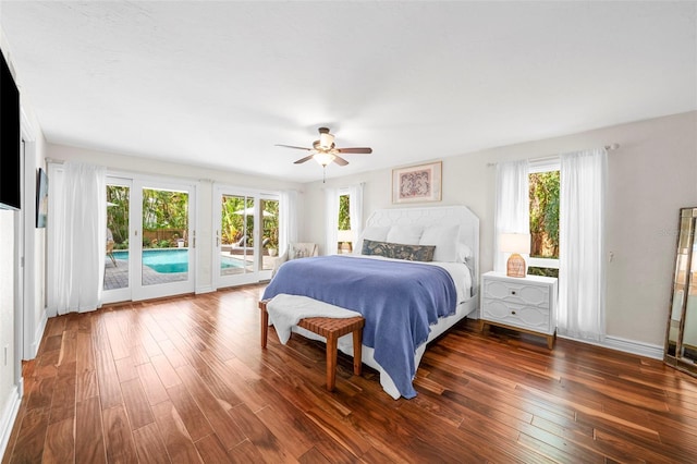 bedroom with multiple windows, ceiling fan, and dark hardwood / wood-style floors