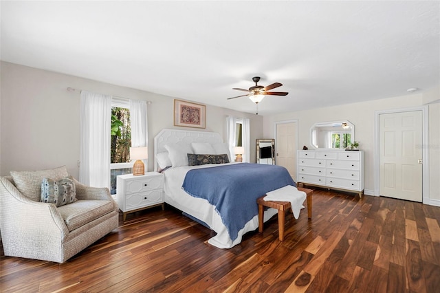 bedroom featuring ceiling fan and dark hardwood / wood-style floors