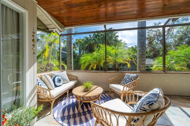 sunroom featuring wood ceiling