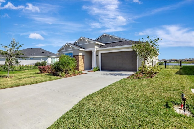 view of front facade with a garage and a front lawn