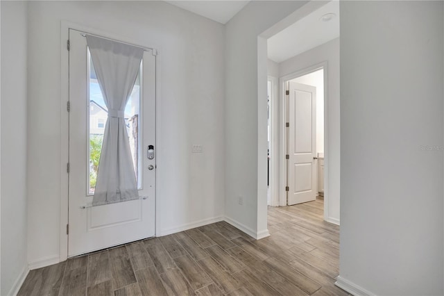 foyer entrance with light hardwood / wood-style flooring