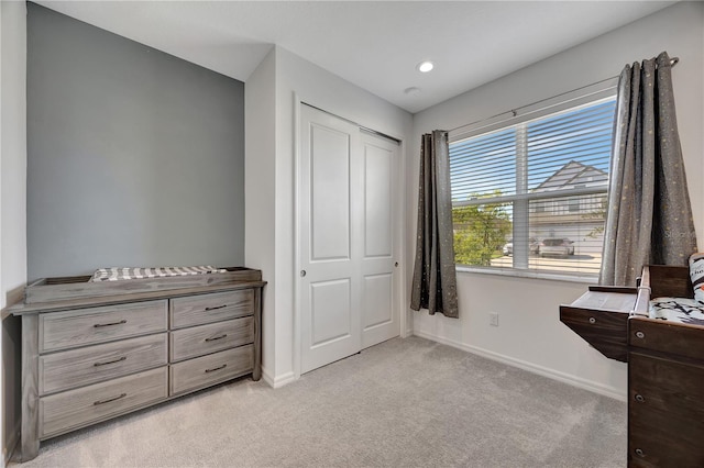 carpeted bedroom featuring a closet