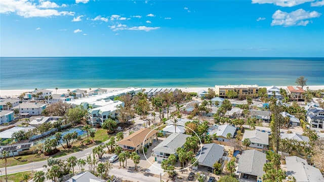 drone / aerial view featuring a water view and a beach view