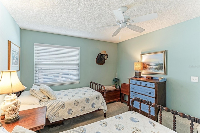 bedroom with carpet flooring, a textured ceiling, and ceiling fan