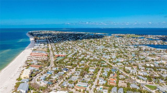 bird's eye view featuring a water view and a view of the beach